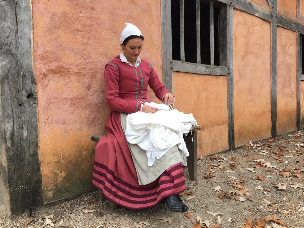 Jamestown-Settlement-historical-interpreter-in-re-created-fort-sewing-shirts.-Jamestown-Yorktown-Foundation-photo.-1.jpg